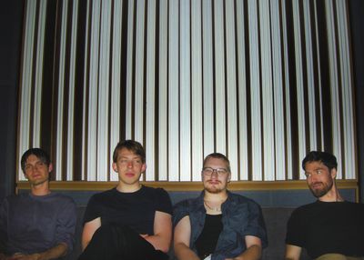Cryptids Band Photo on couch